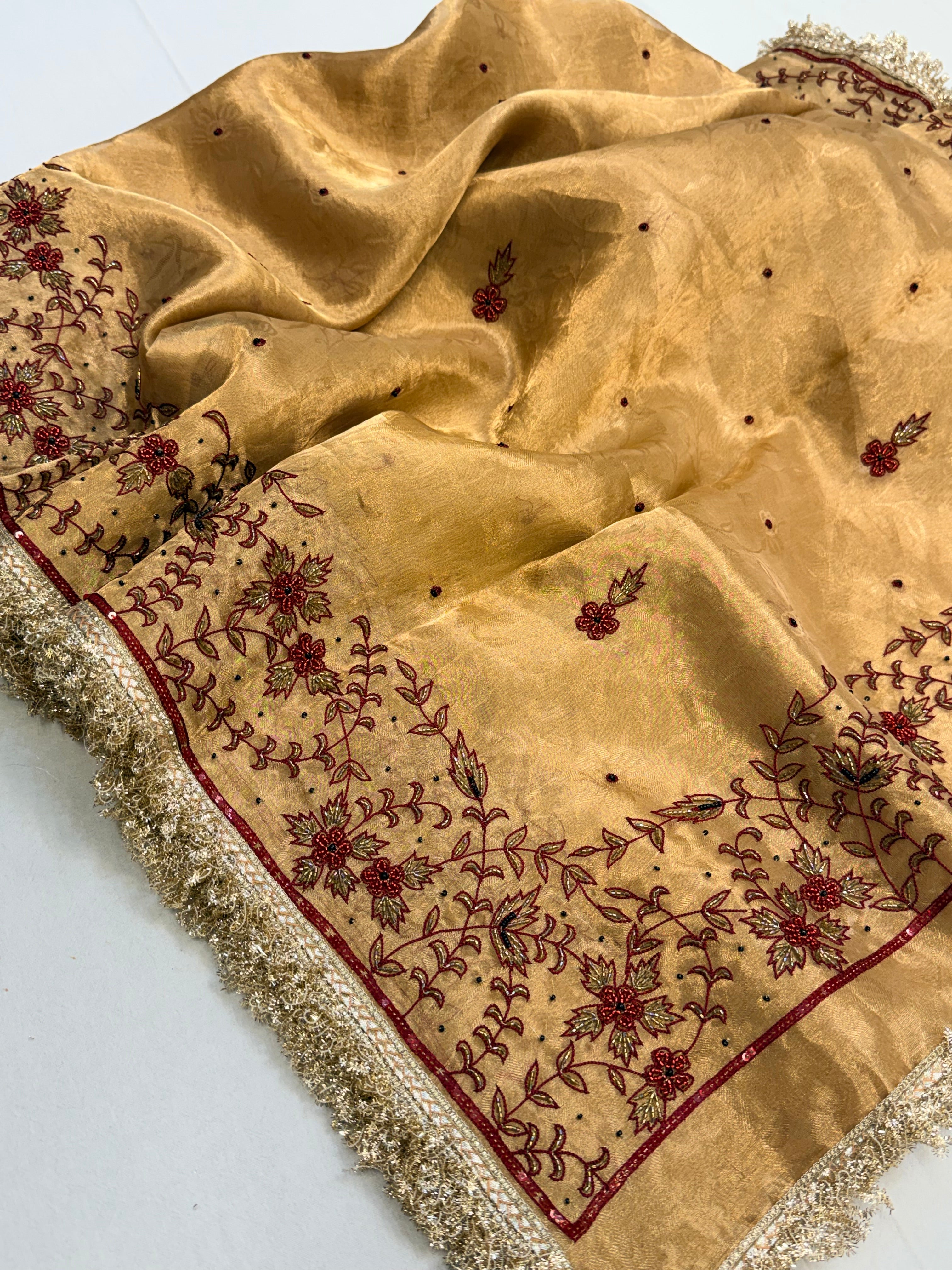 Molten gold tissue silk hand embroidered kadhwa saree