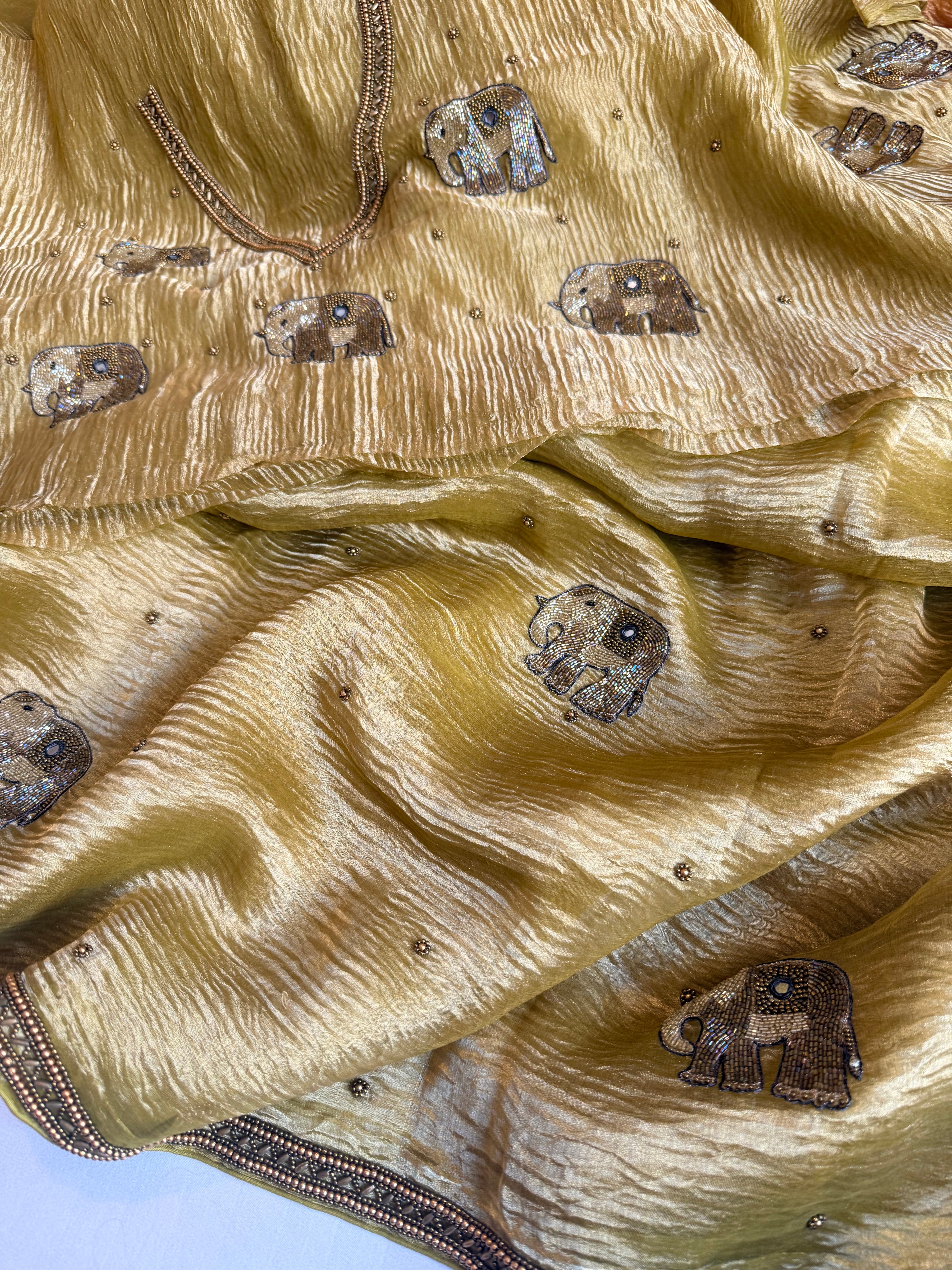 Mirrorwork edit lemon yellow crushed tissue silk hand embroidered saree