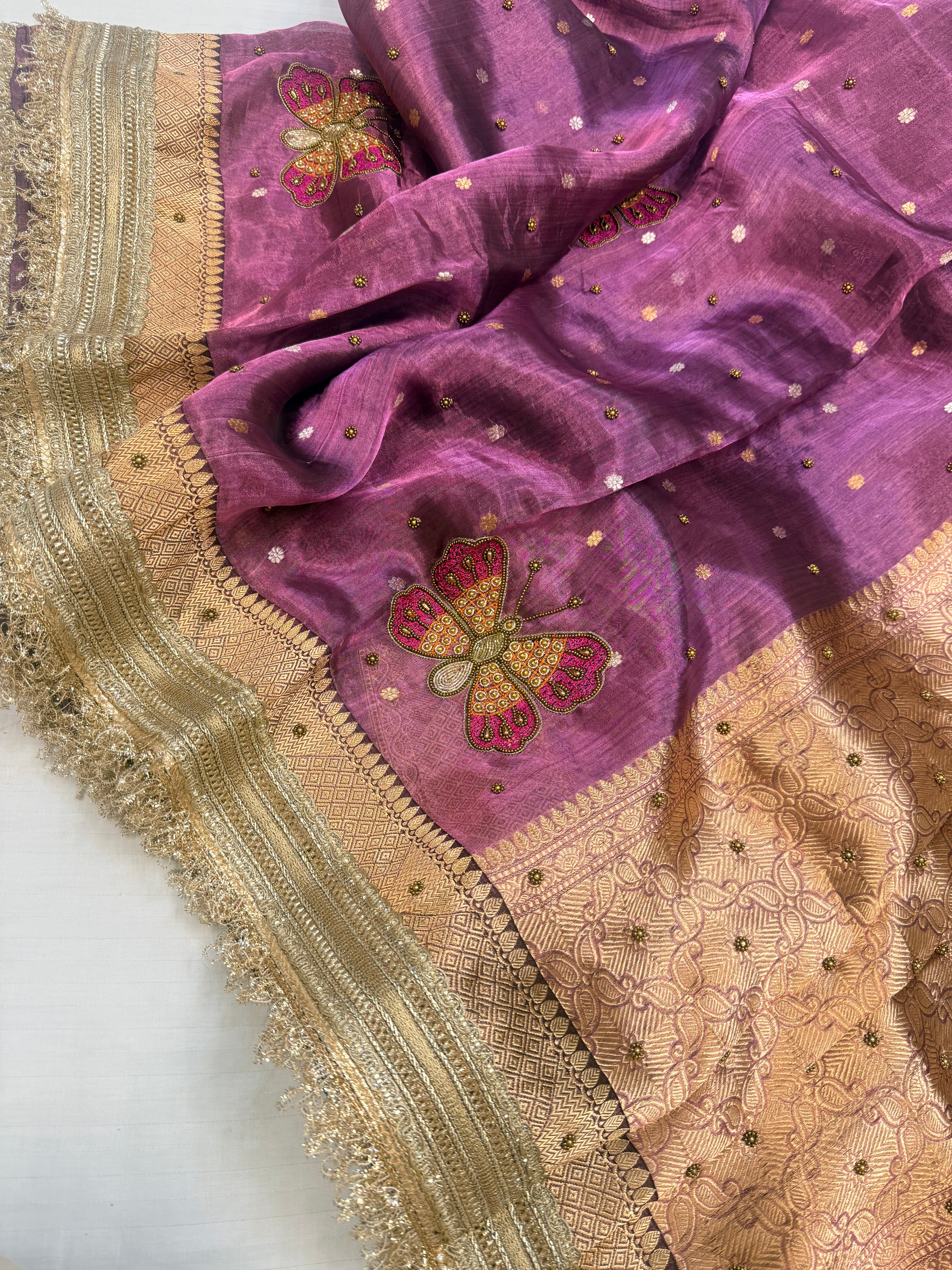 Metallic brinjal purple husn tissue silk hand embroidered saree