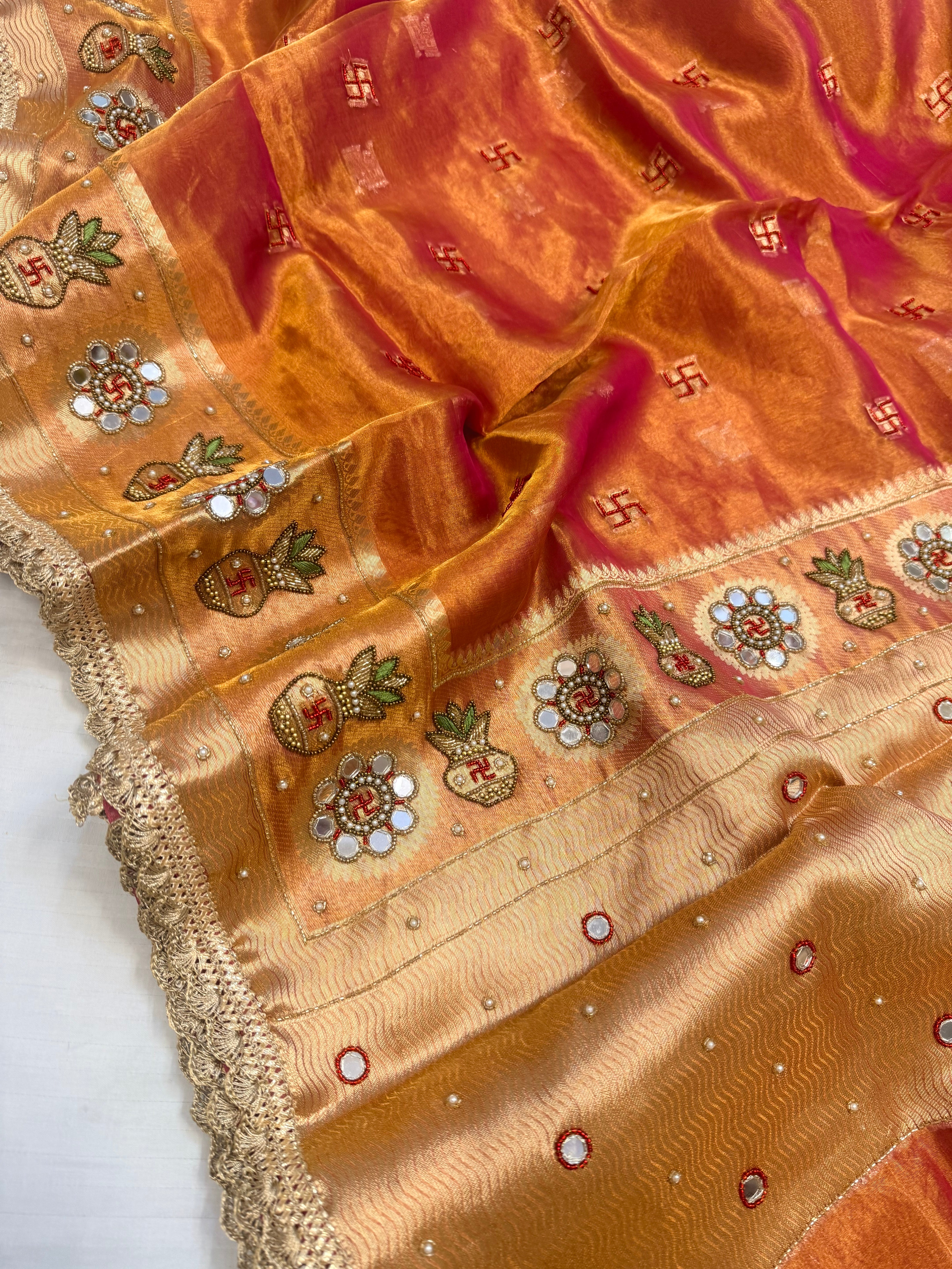 Metallic rani-orange dhup chao tissue silk hand embroidered mirrorwork saree