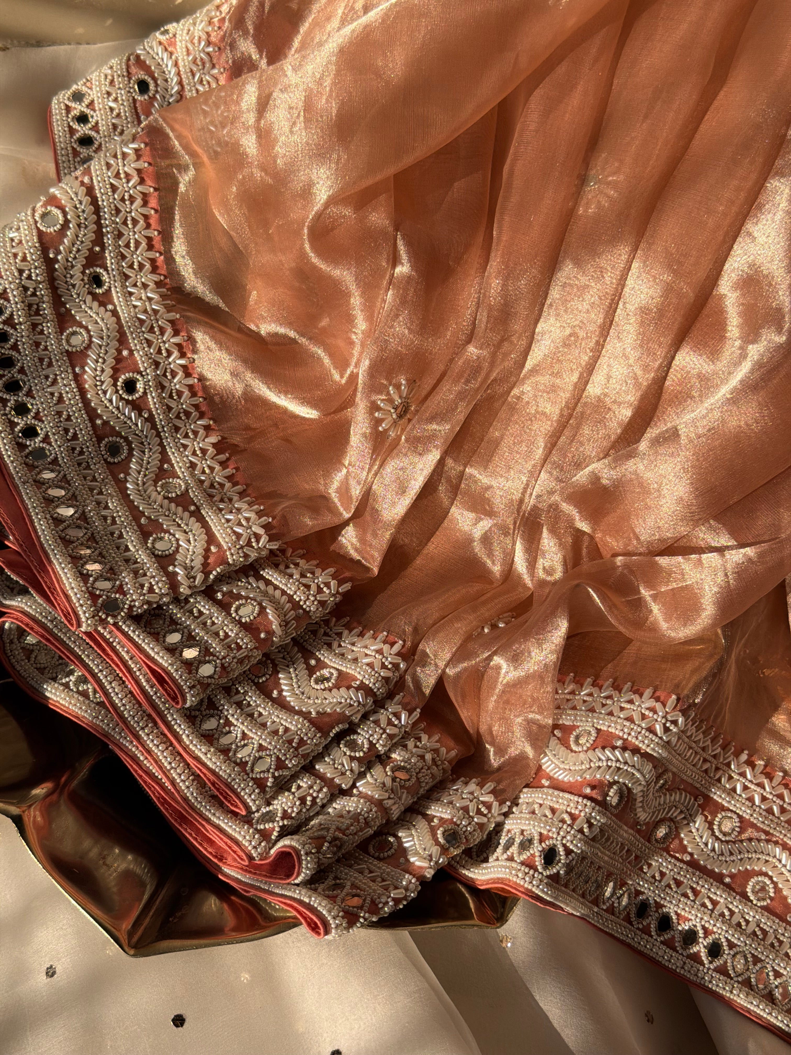 Gajri peach mirrorwork and pearlwork hand embroidered diamond tissue saree