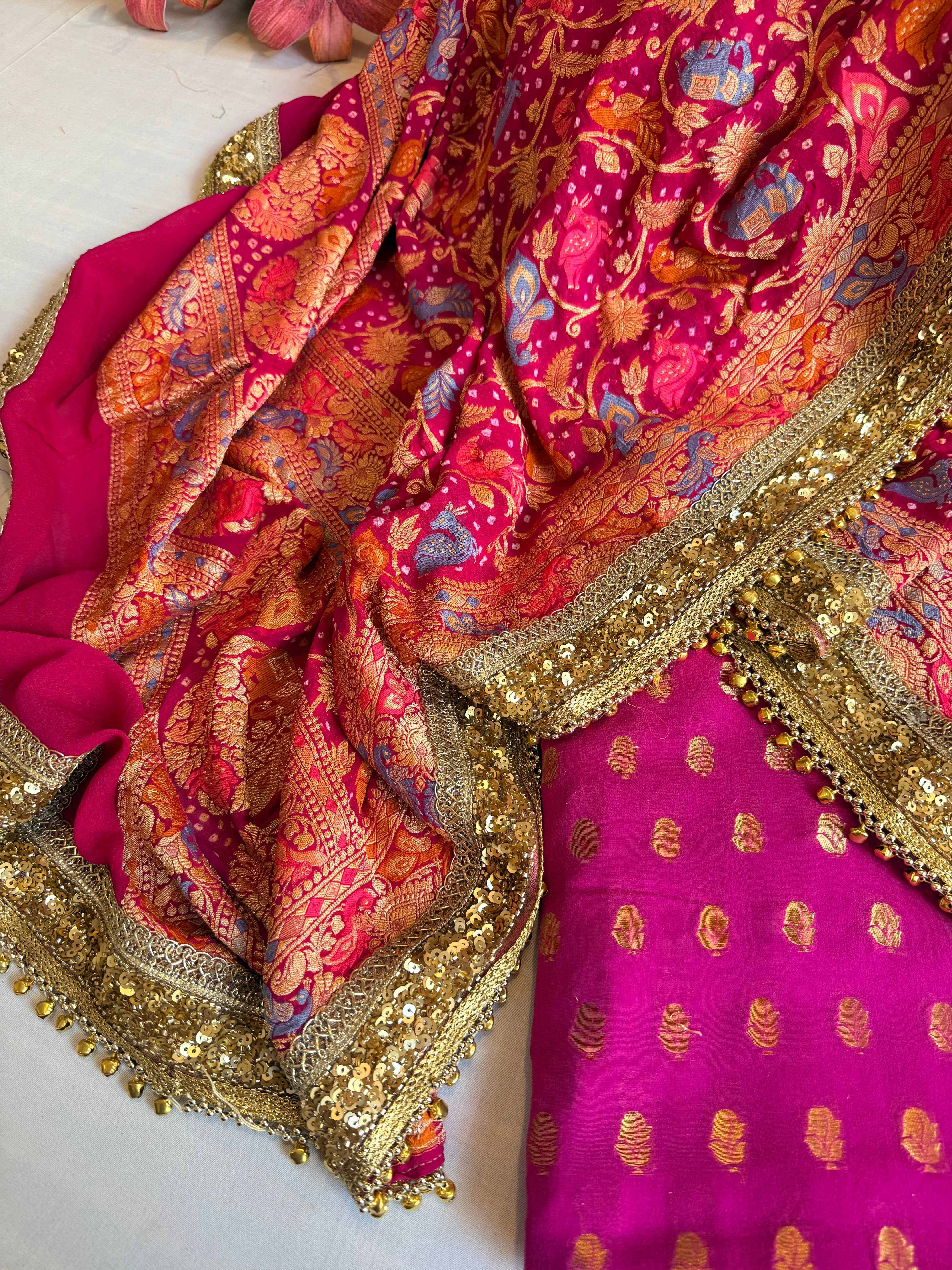 Banarasi hot pink bandhej ghungroo and sequin work chiffon gorgette kadhwa suit set