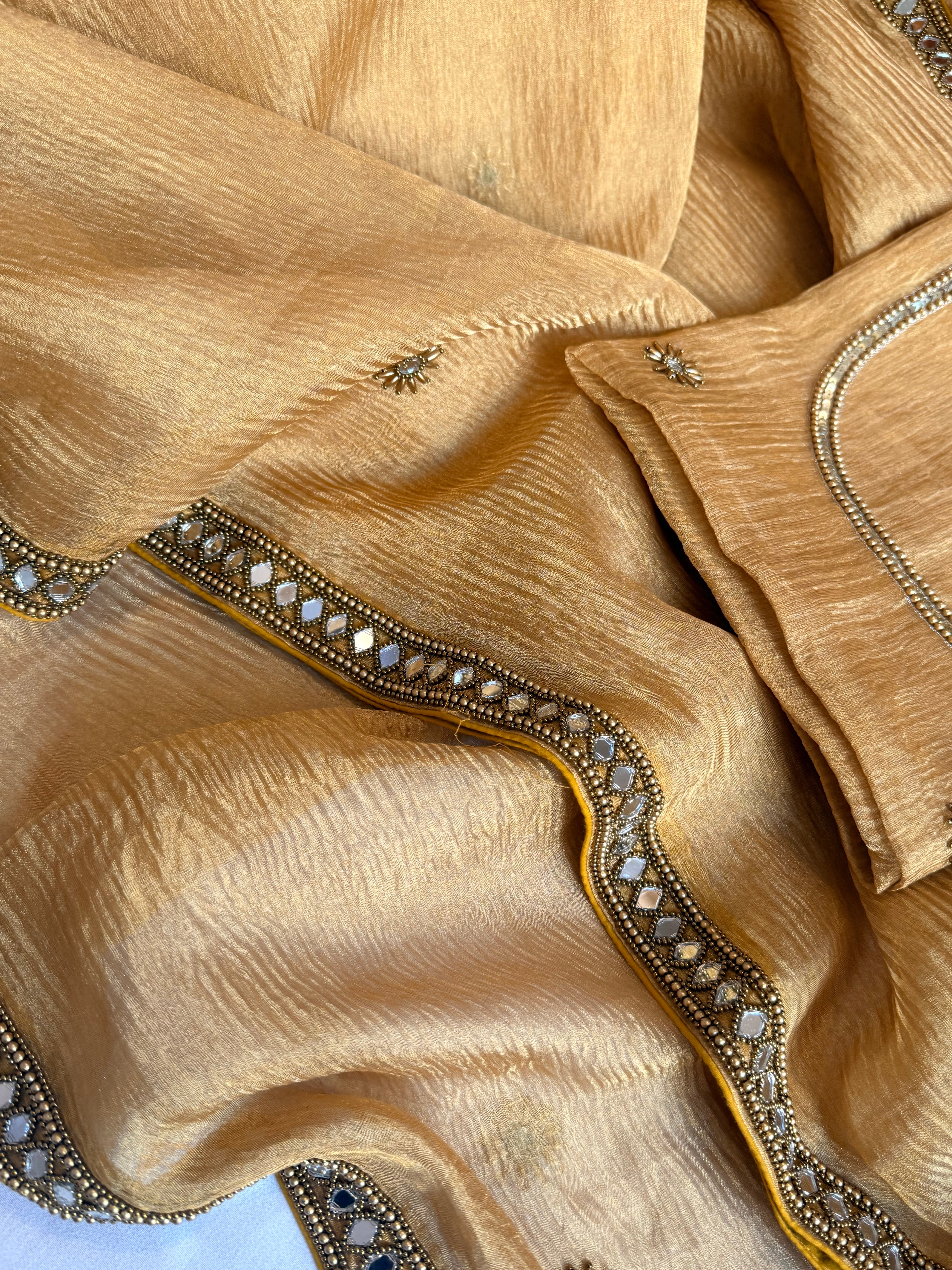 Mirrorwork edit light orange crushed tissue silk hand embroidered saree