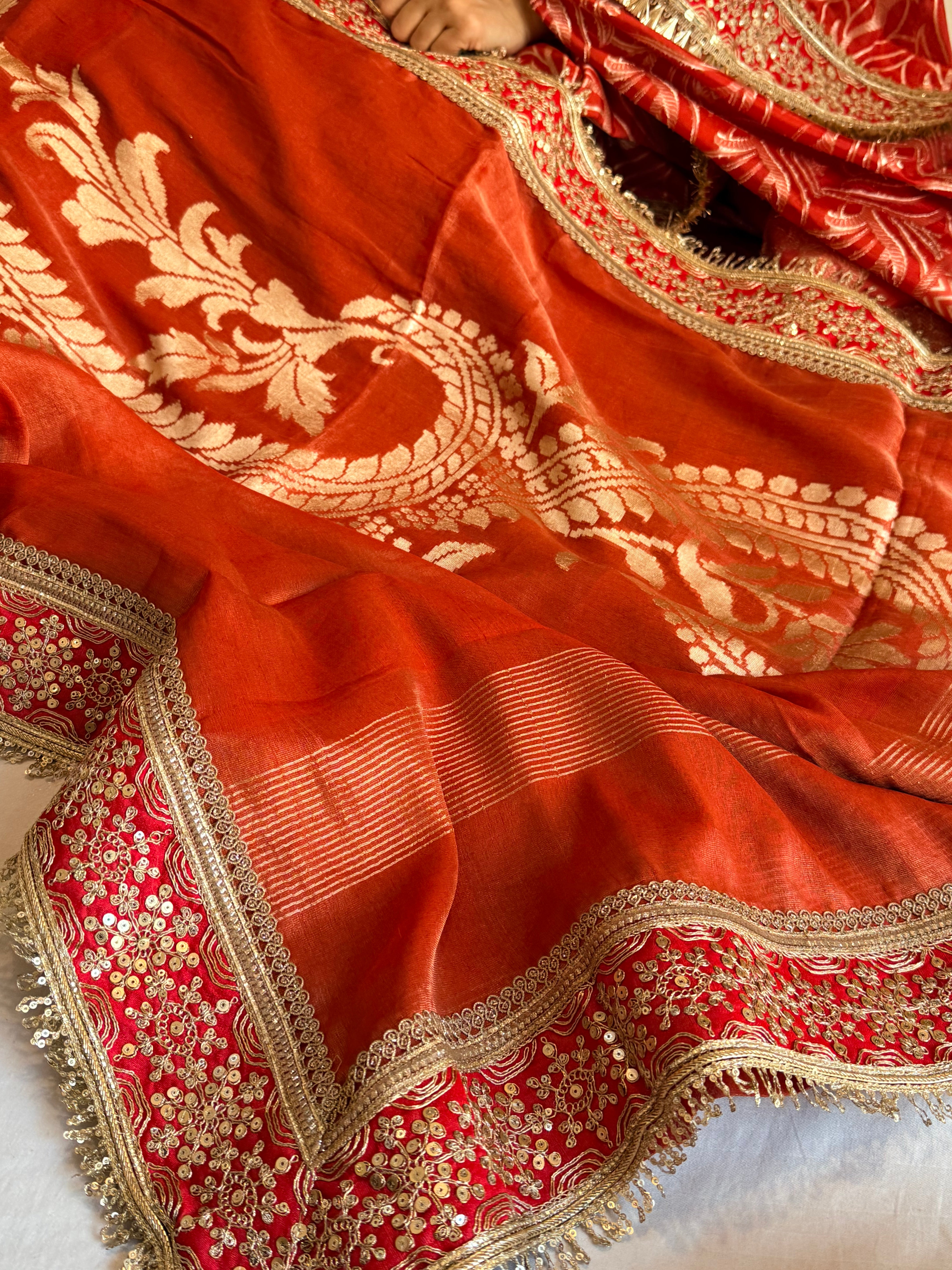 Rustic orange tissue gorgette kadhwa motif saree