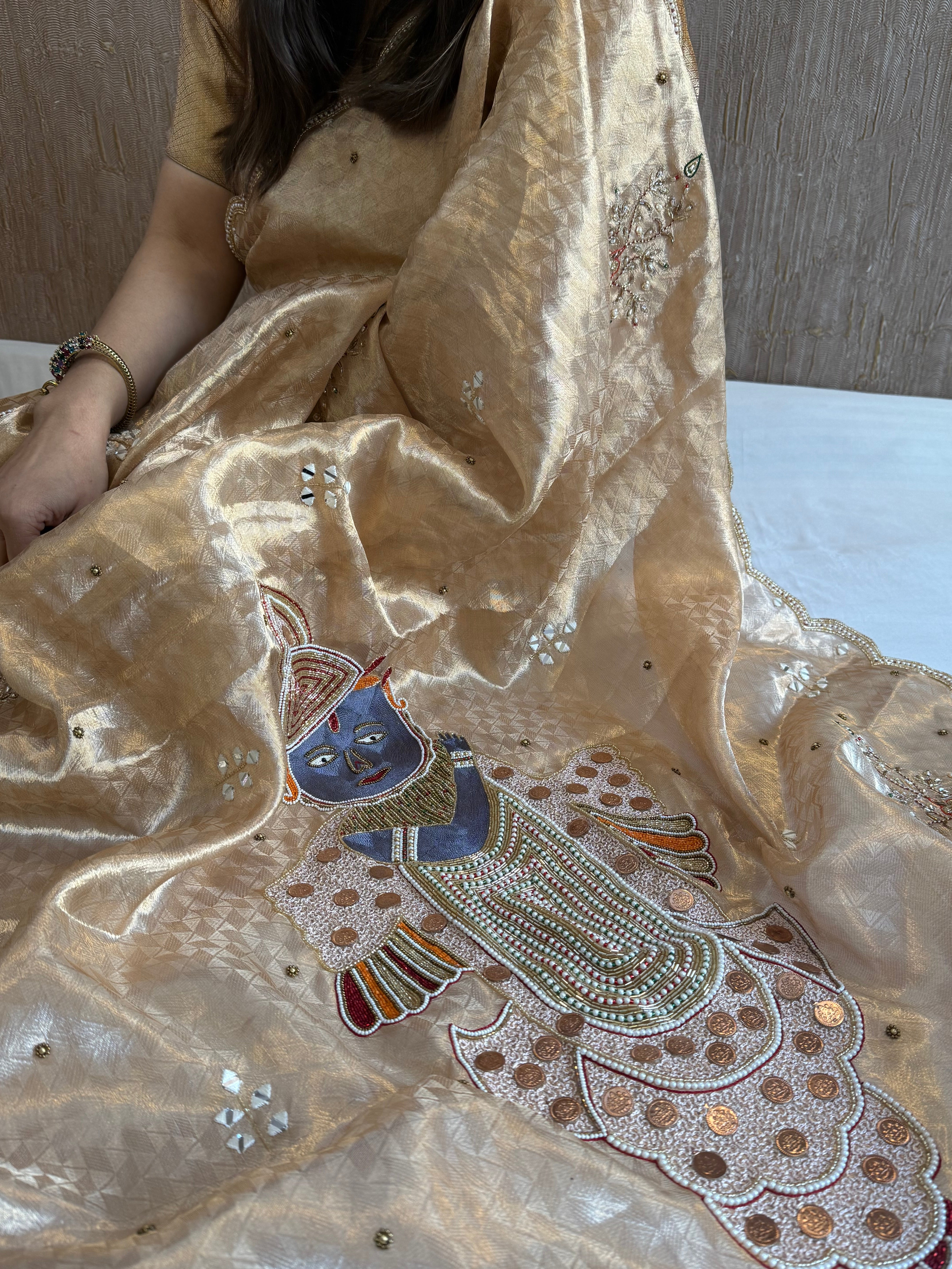 Shrinathji motif inspired molten tissue brocade kadhwa weaving hand embroidered saree