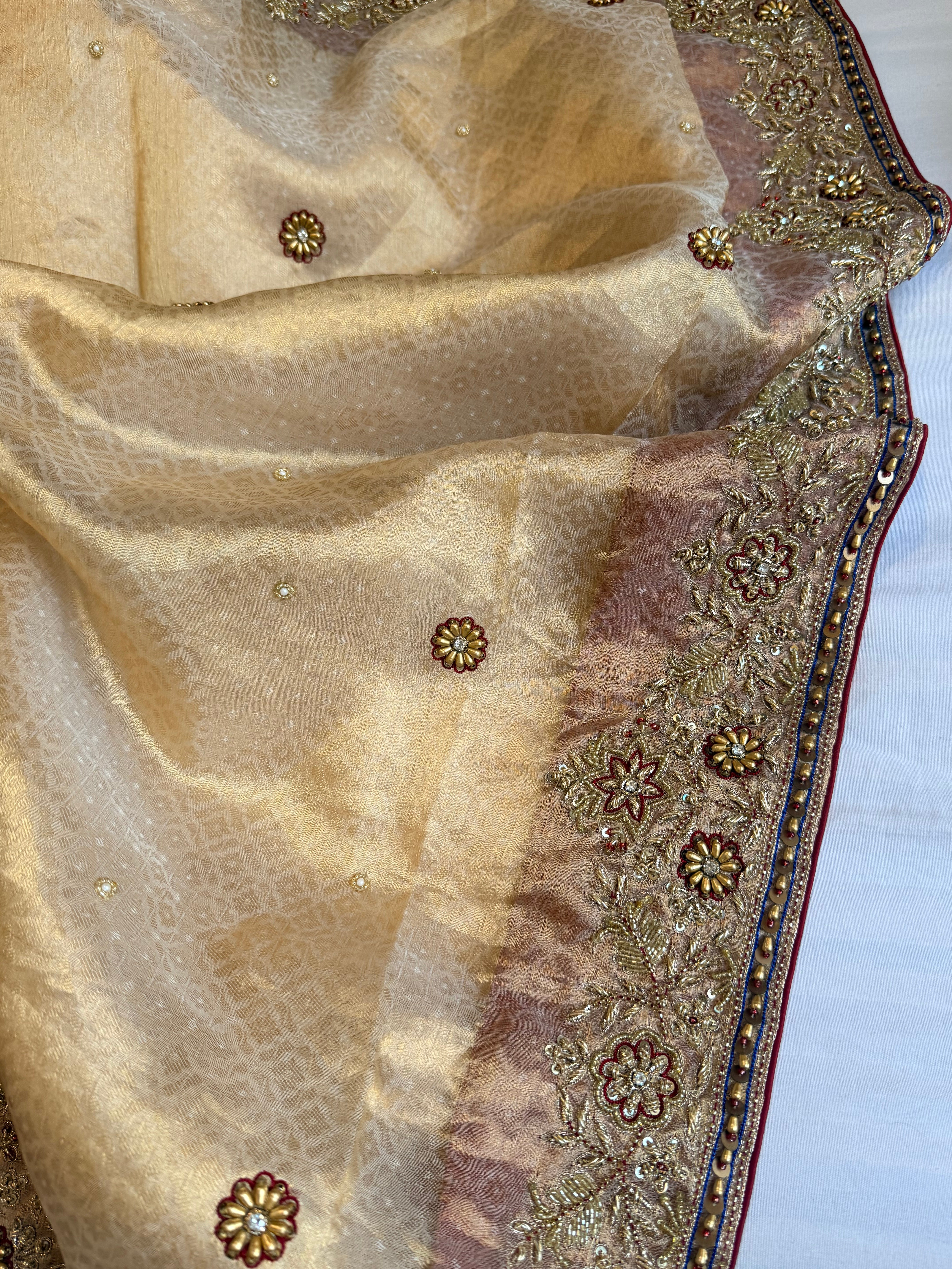 Zardozi & Jadauwork border tissue silk hand embroidered kadhwa butter gold saree