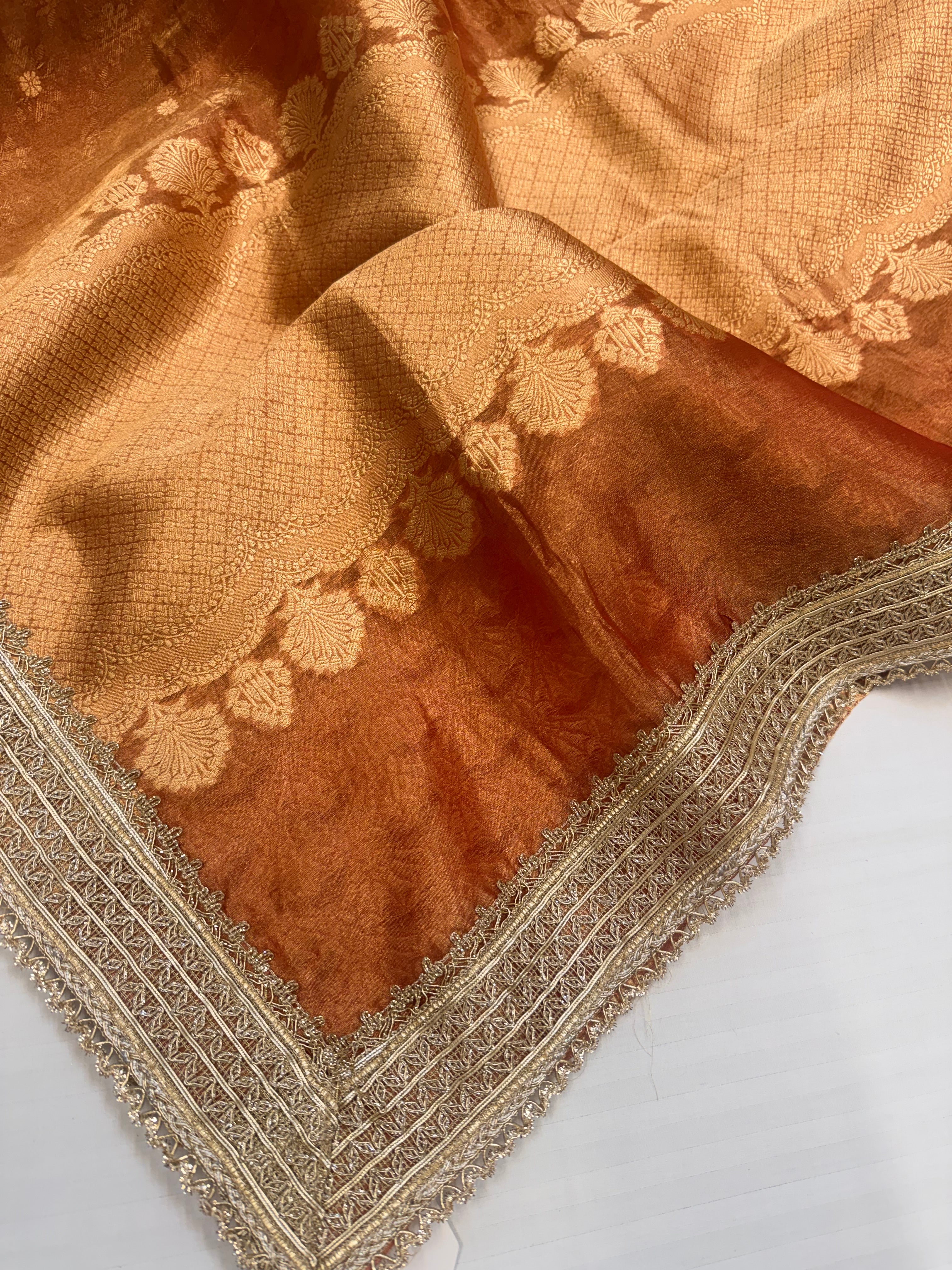 Tangerine red tissue silk kadhwa buti and striped gotapatti saree