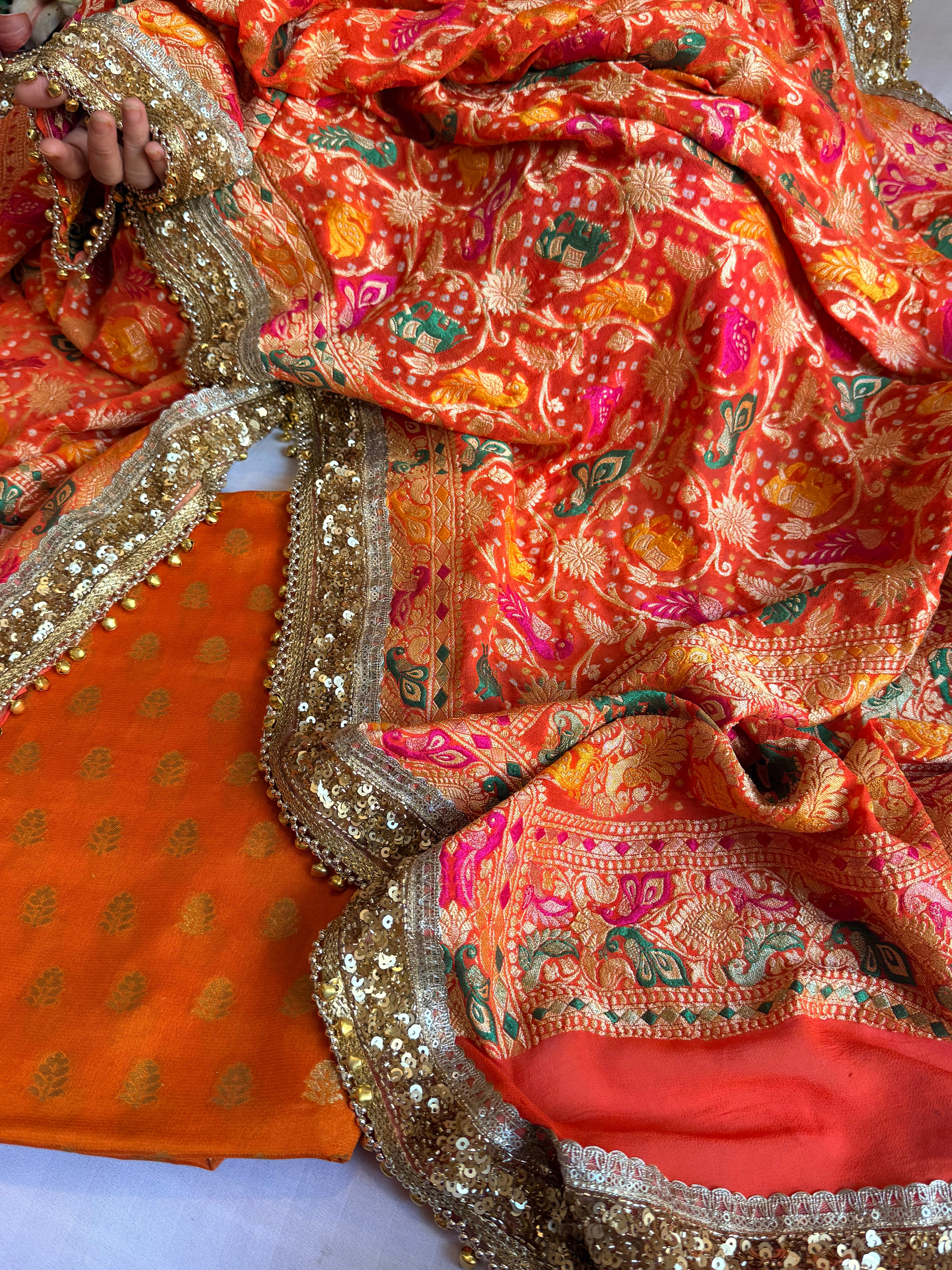 Banarasi bandhej fanta orange ghungroo and sequin work chiffon gorgette kadhwa suit set