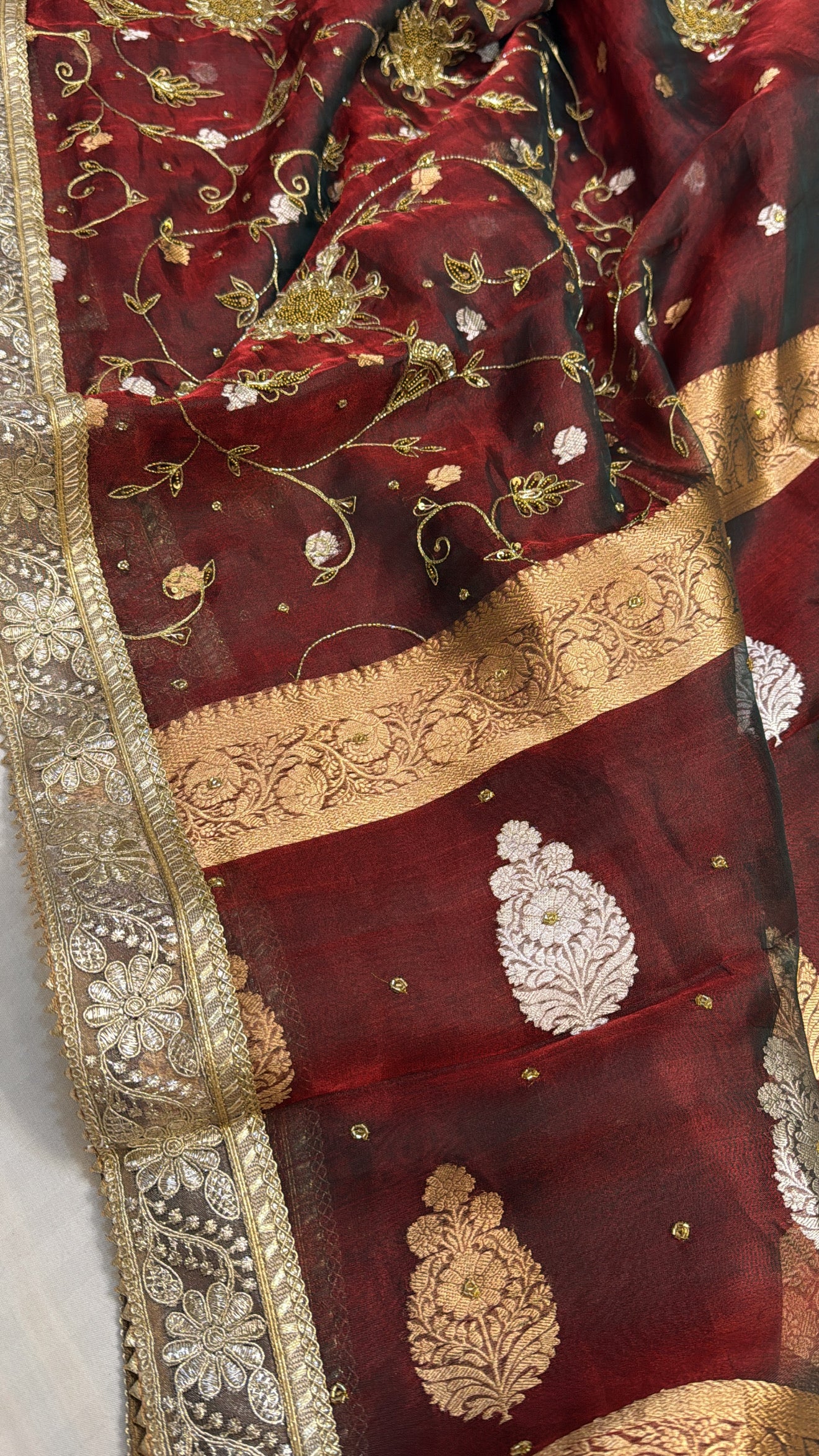 Maroonish blood red tissue silk jaalwork hand embroidered kadhwa saree