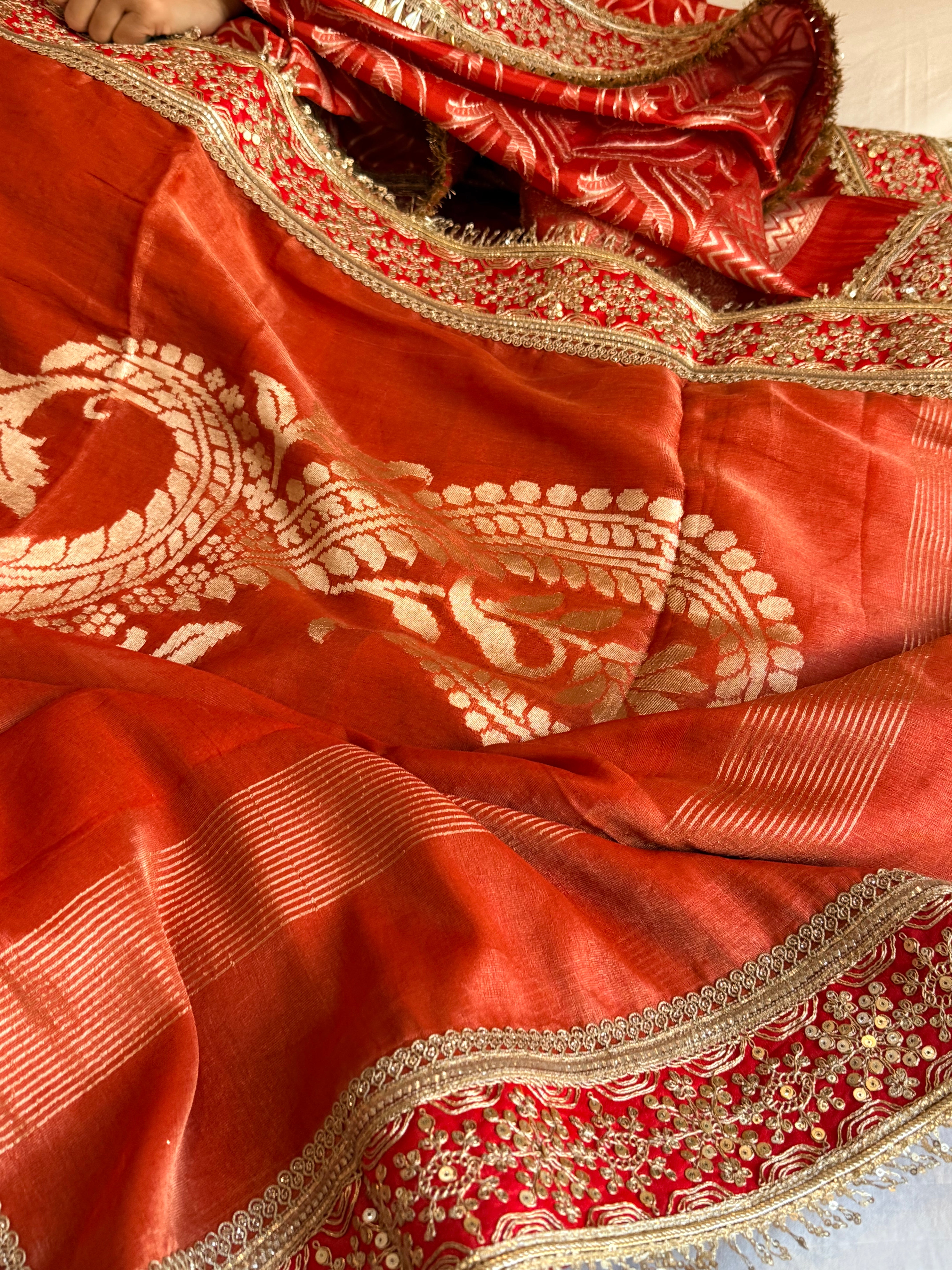 Rustic orange tissue gorgette kadhwa motif saree