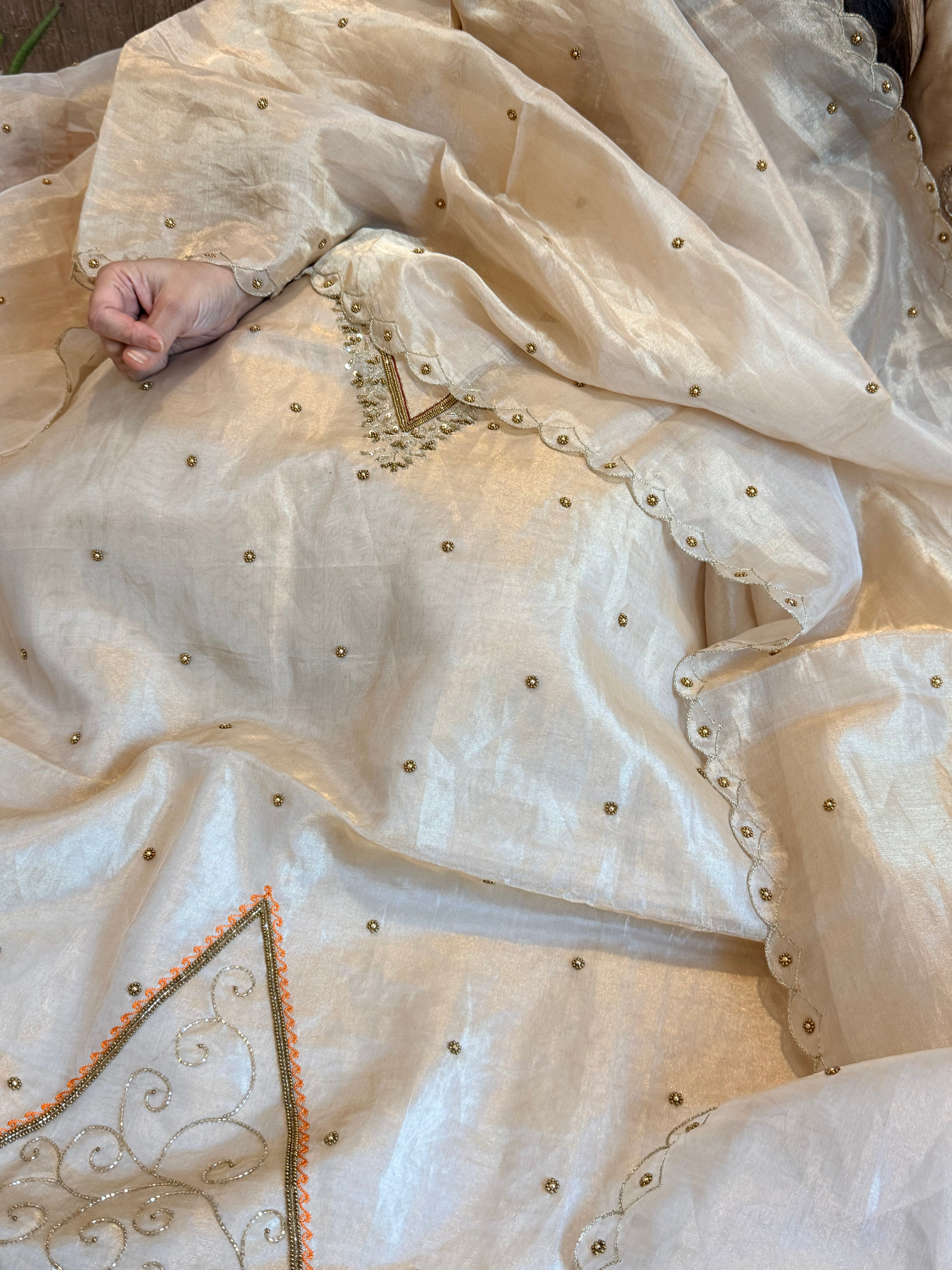 Golden tissue silk meenakari weaving hand embroidered suits