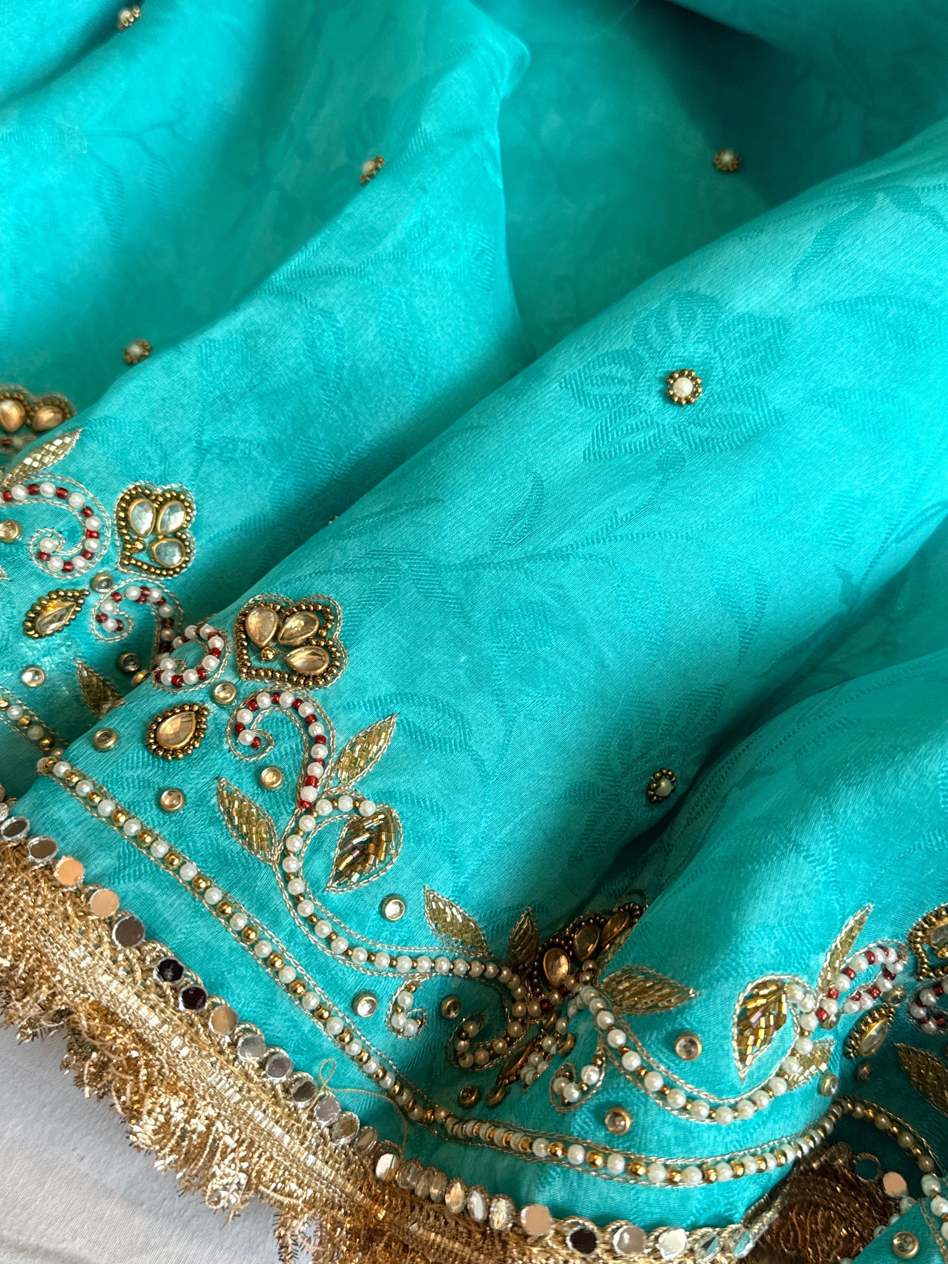 Jadauwork tissue tanchoi silk hand embroidered kadhwa saree