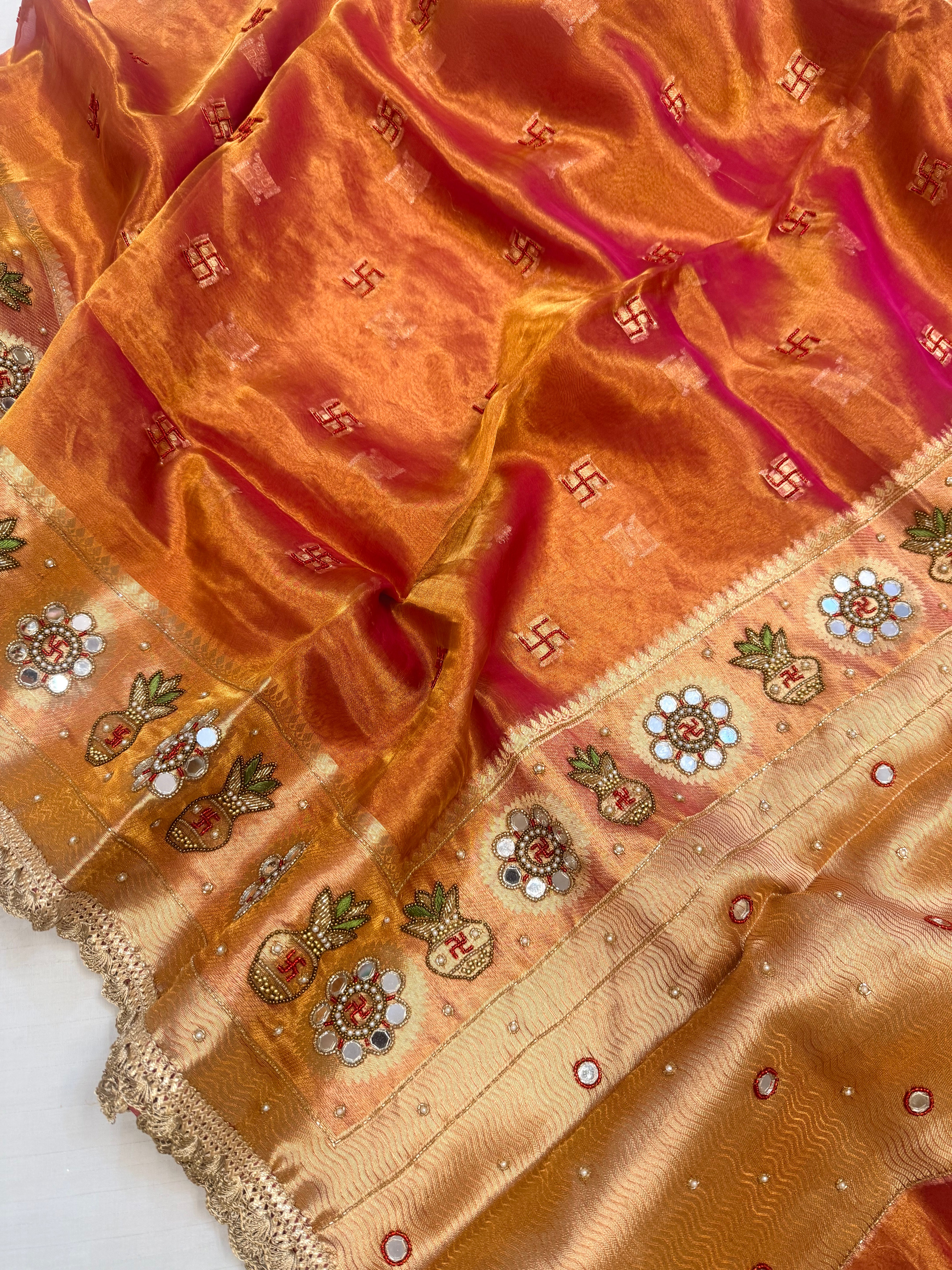 Metallic rani-orange dhup chao tissue silk hand embroidered mirrorwork saree