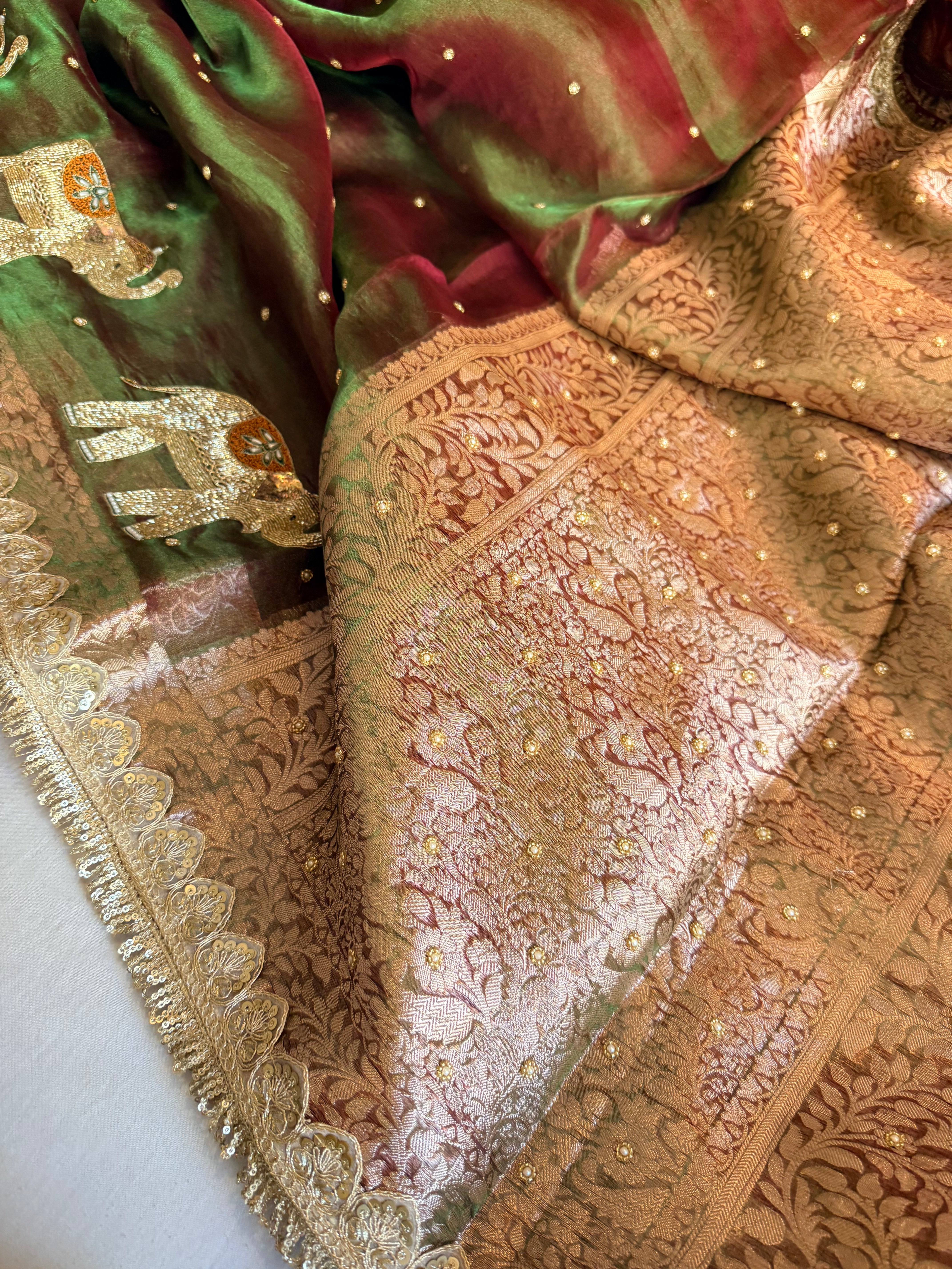 Elephant motif mehendi green dhup chao effect tissue silk hand embroidered saree