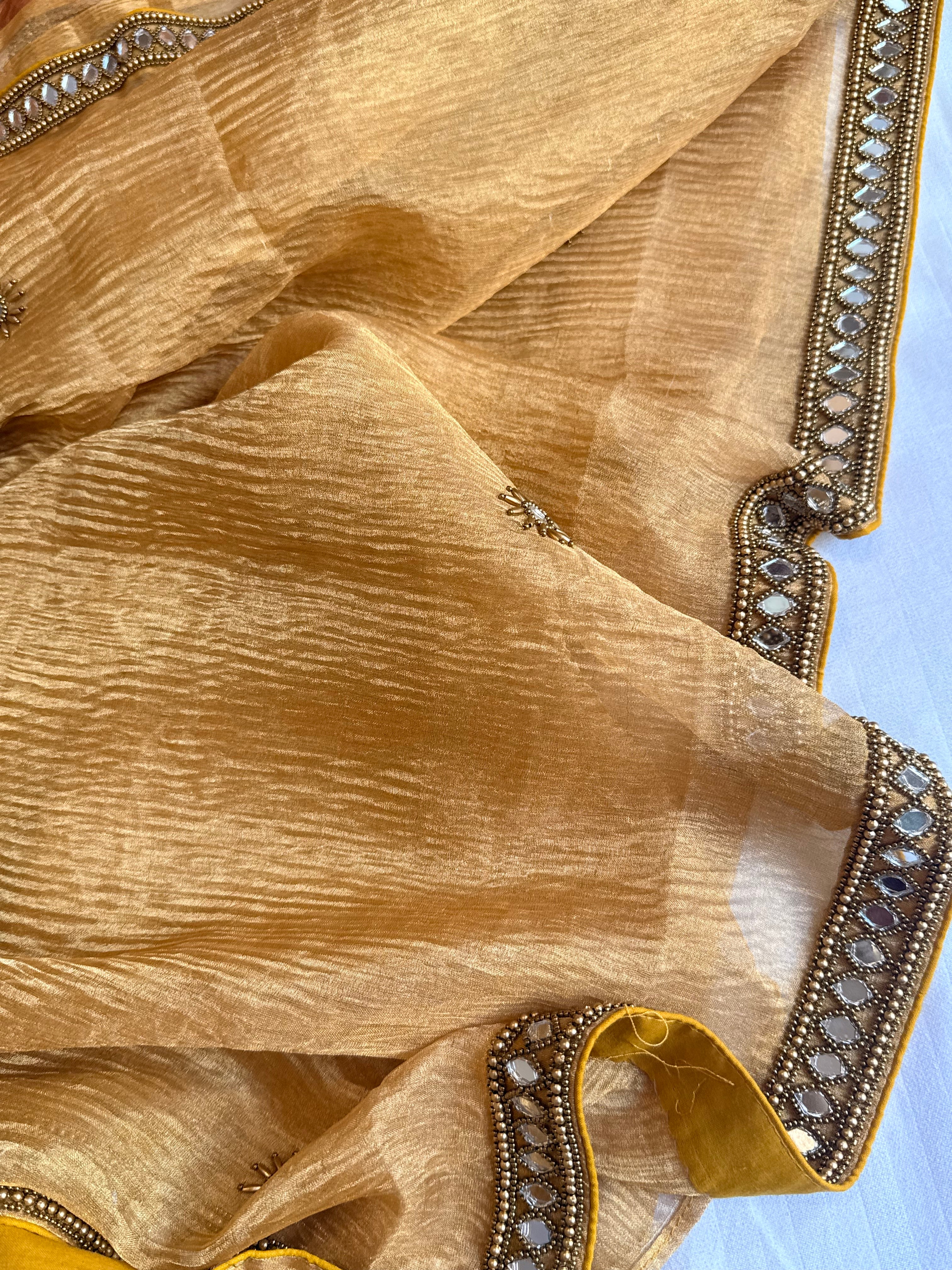 Mirrorwork edit light orange crushed tissue silk hand embroidered saree
