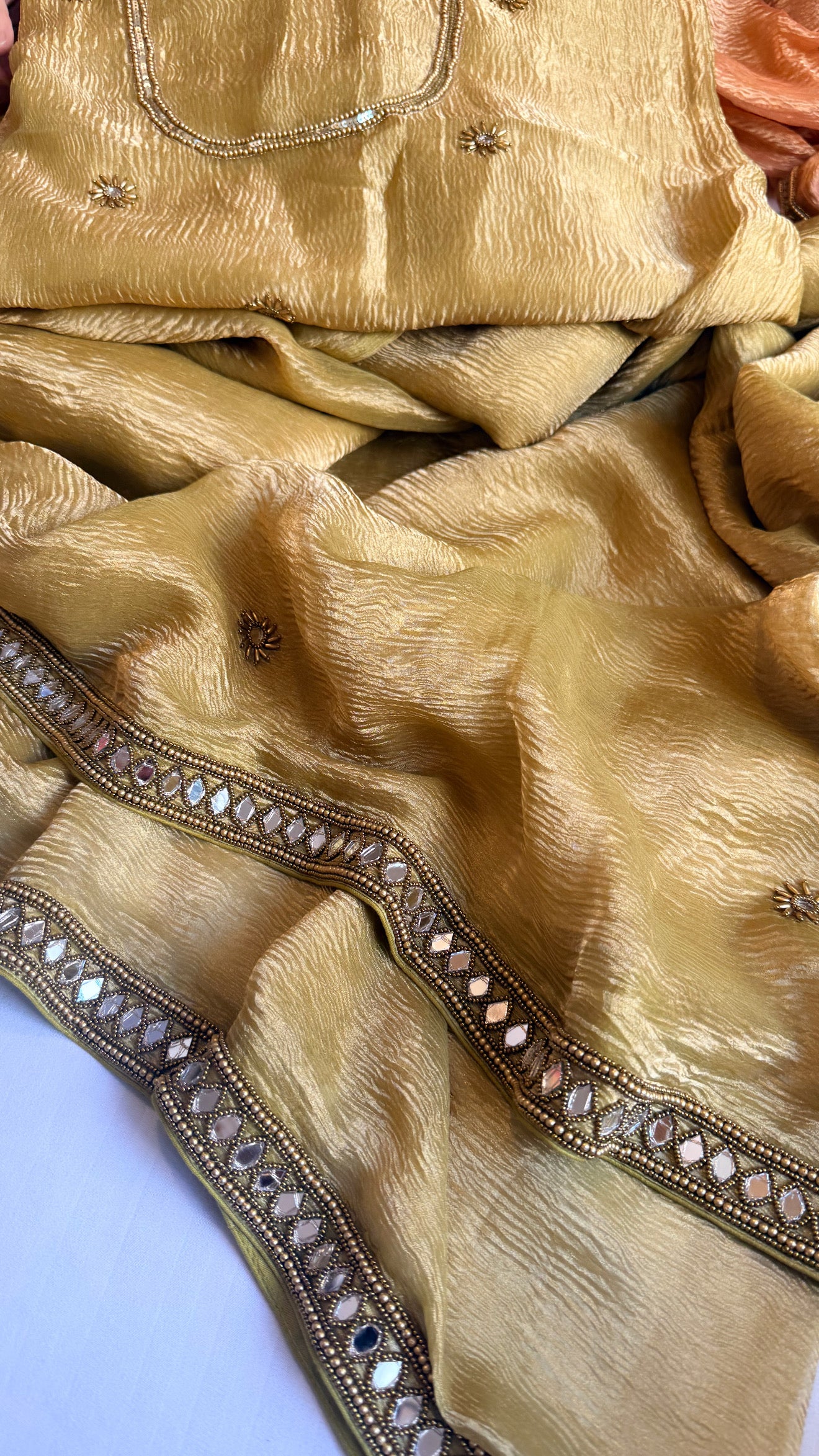 Mirrorwork edit mustard gold crushed tissue silk hand embroidered saree