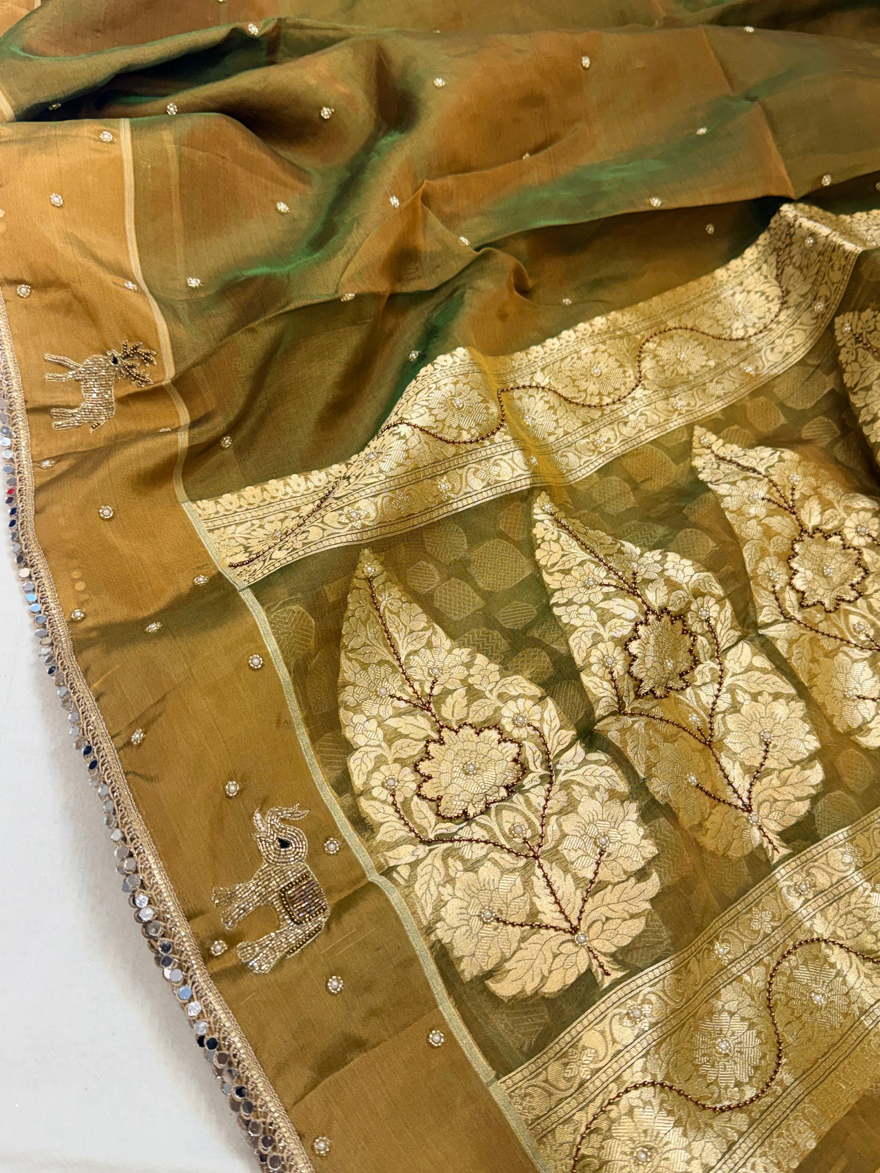 Mehendi green dhup chao effect tissue silk hand embroidered saree