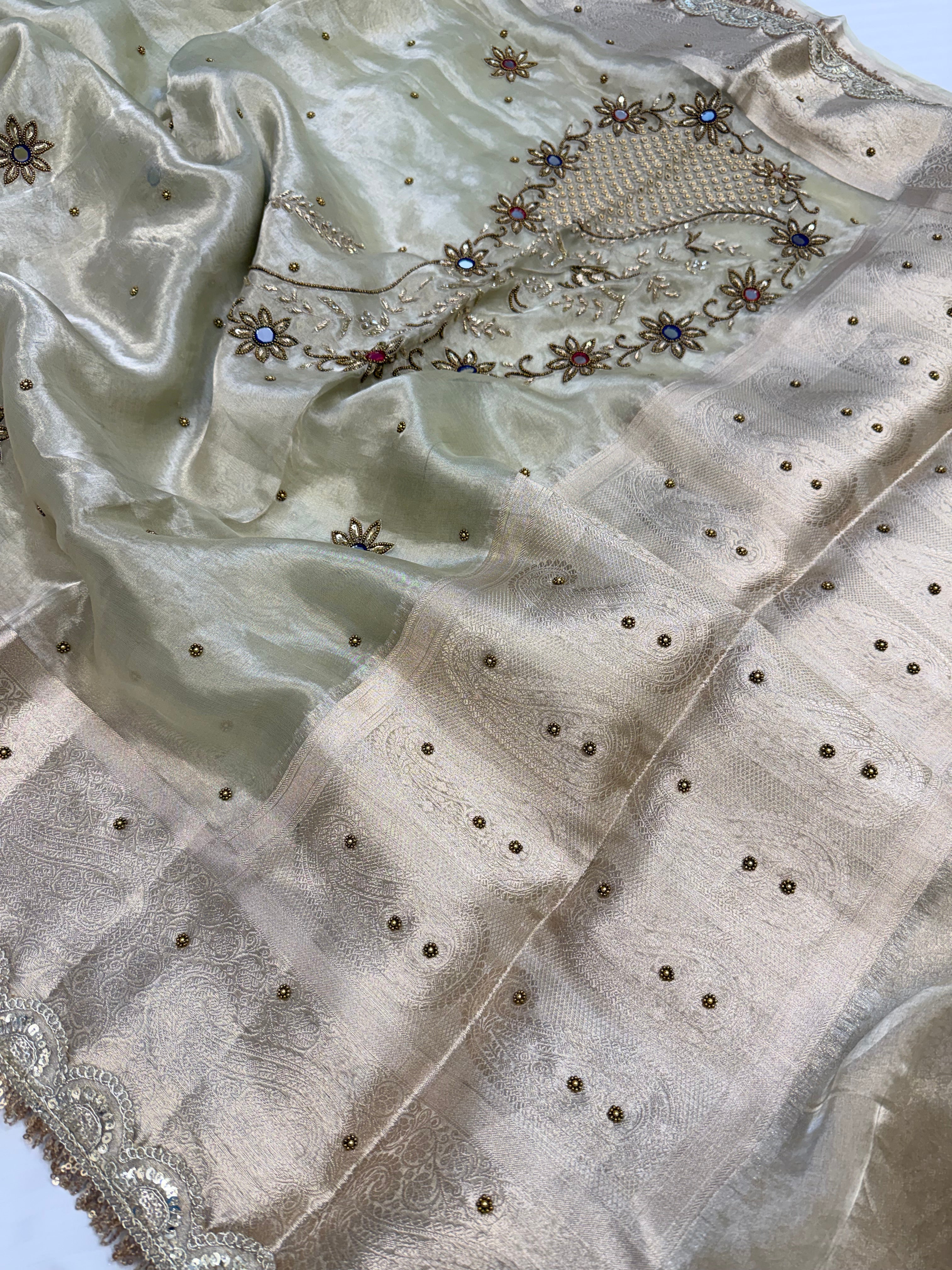 Mint green husn tissue silk carry motif hand embroidered saree