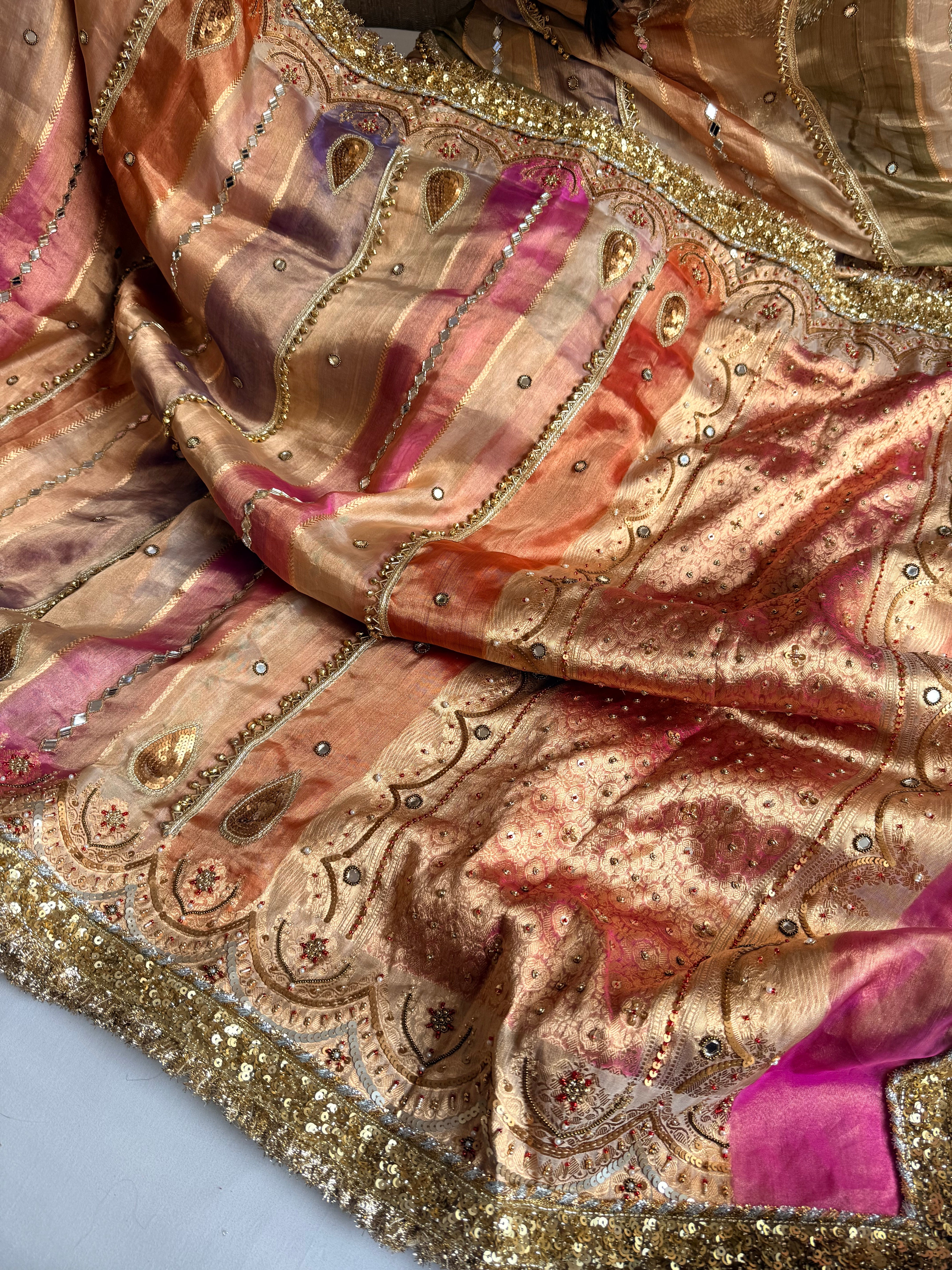Navratan edit tissue silk rangkaat and ghungroo work hand embroidered saree