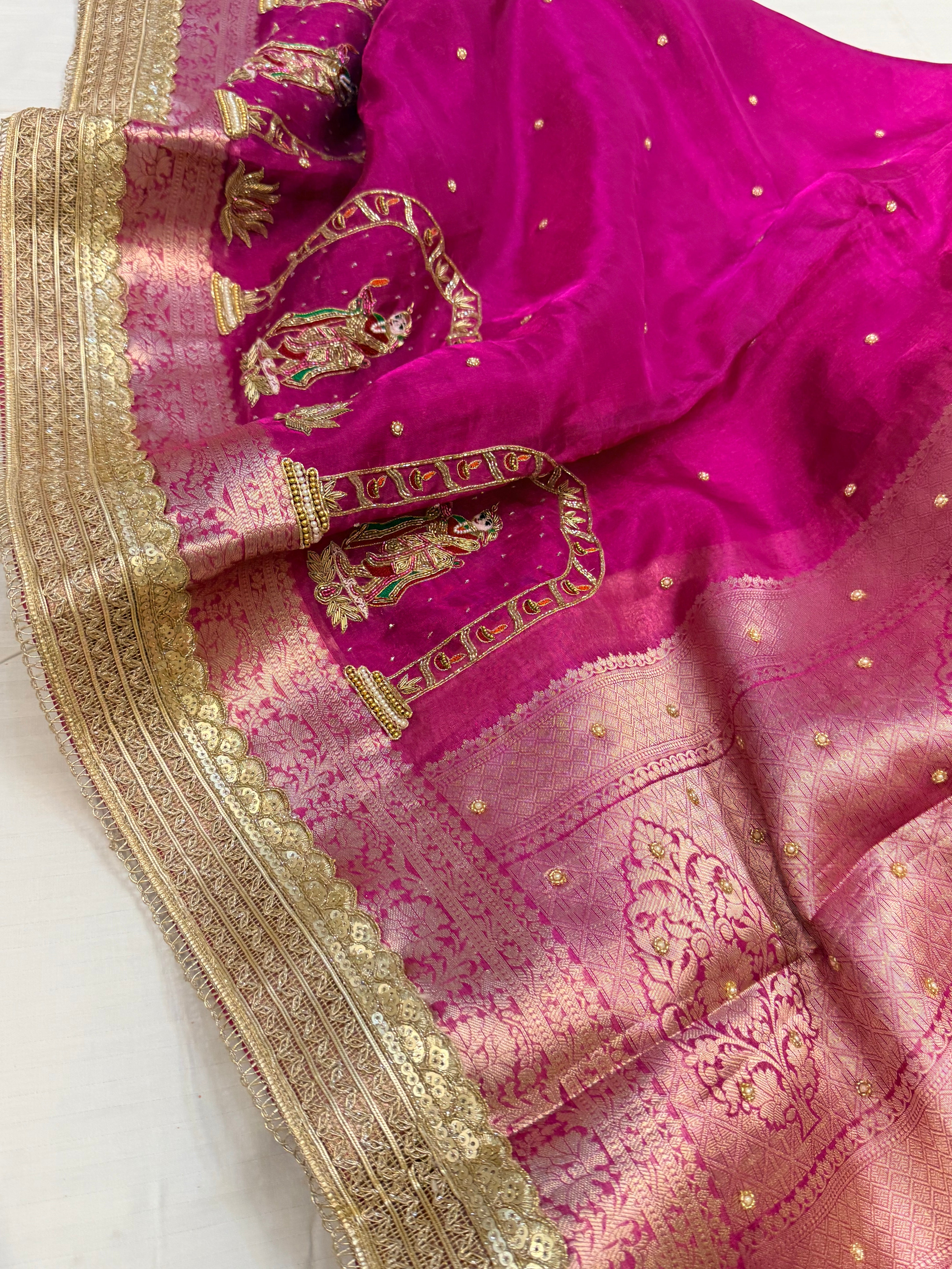 Rani pink husn tissue silk krishna motif hand embroidered saree