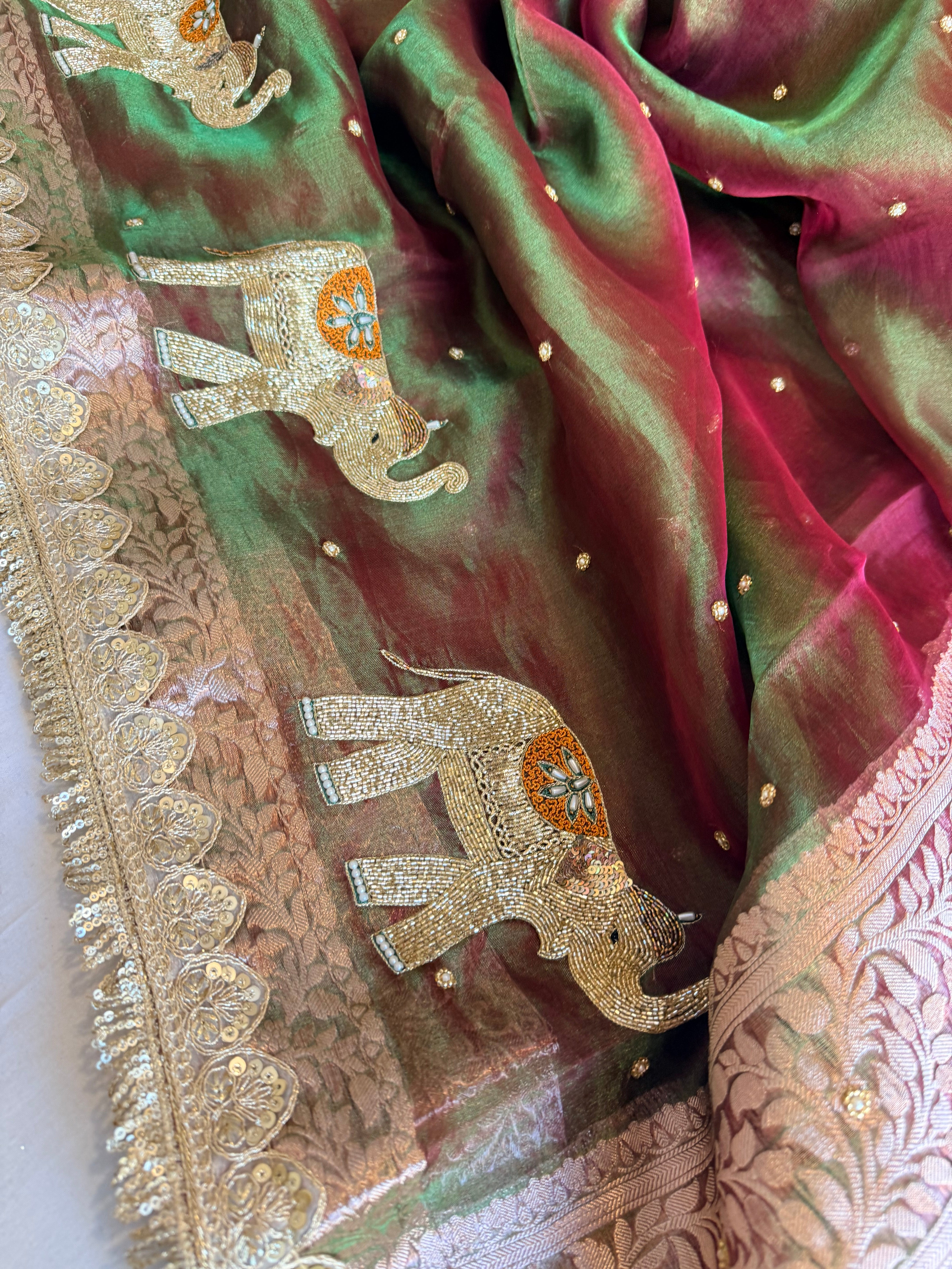 Elephant motif mehendi green dhup chao effect tissue silk hand embroidered saree