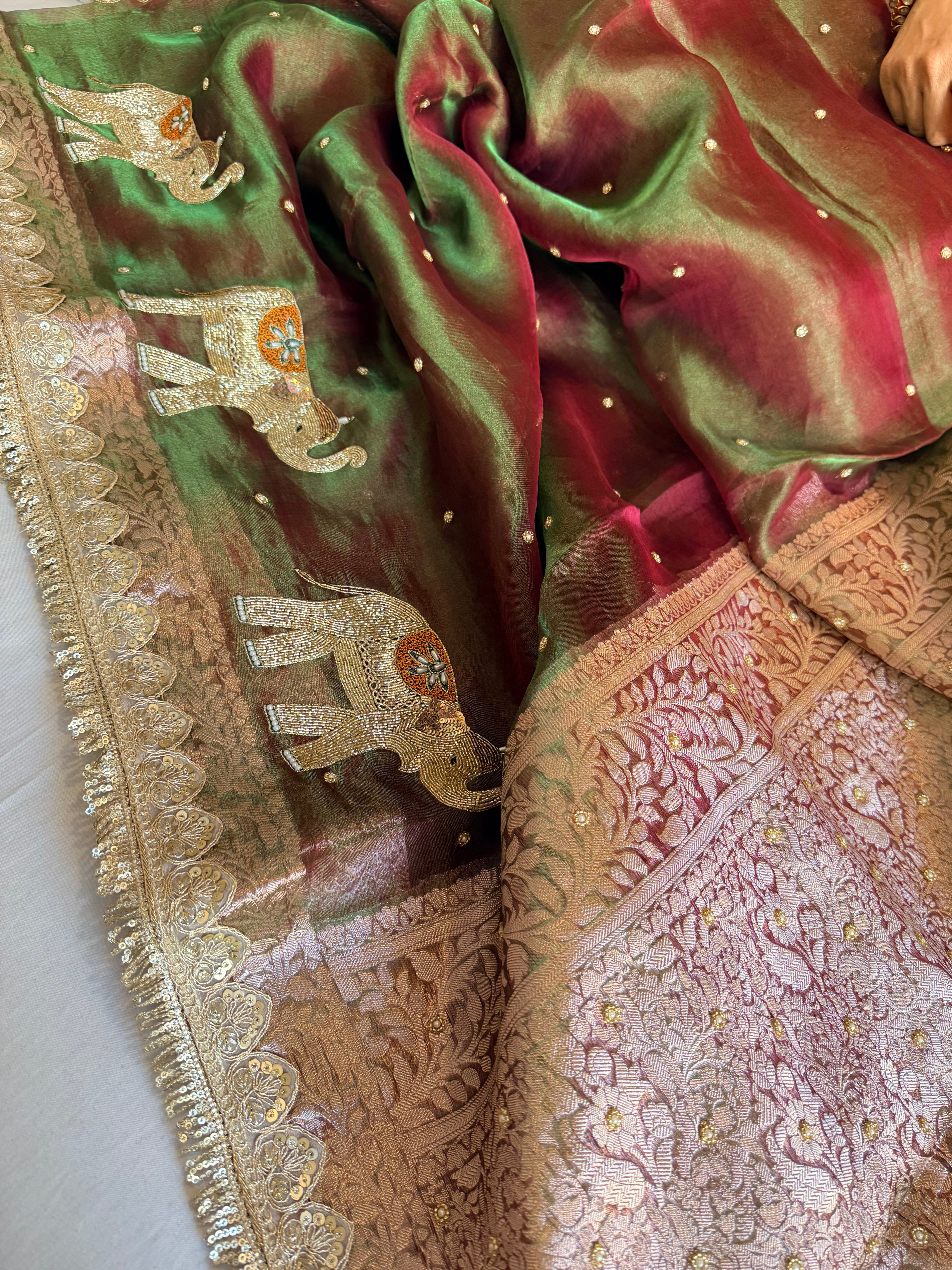 Elephant motif mehendi green dhup chao effect tissue silk hand embroidered saree