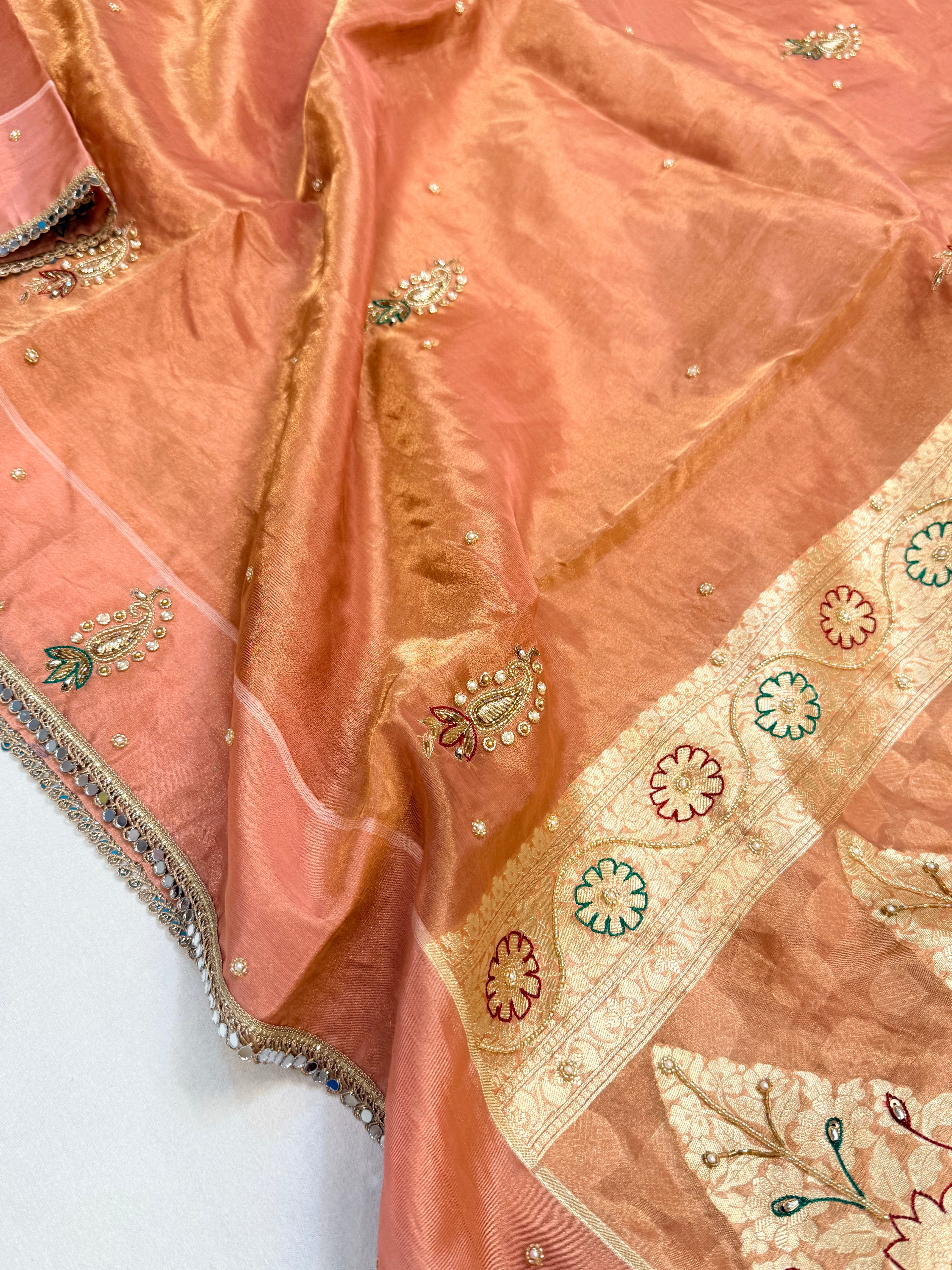 Peachy pink tissue silk hand embroidered kadhwa saree