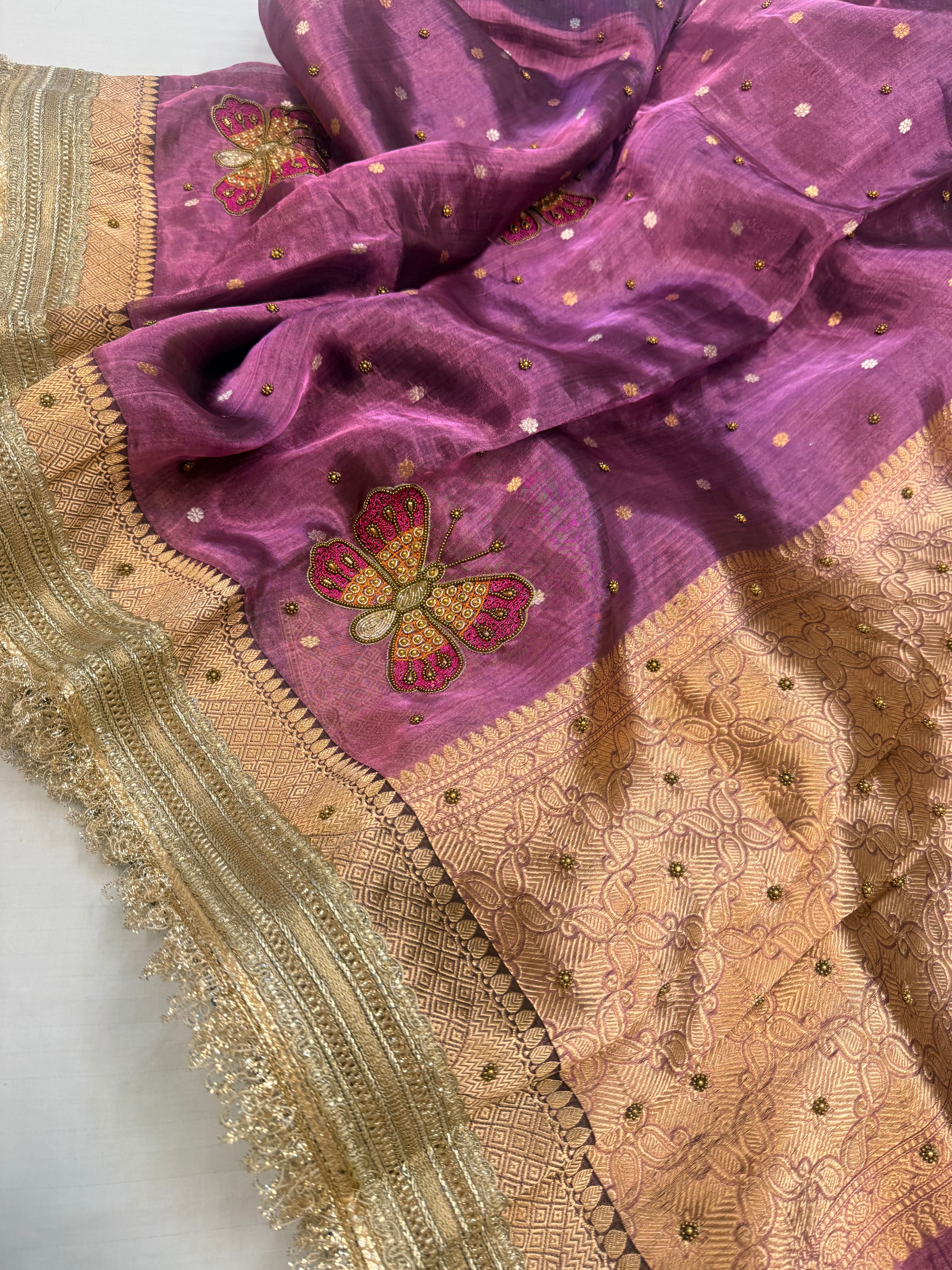Metallic brinjal purple husn tissue silk hand embroidered saree