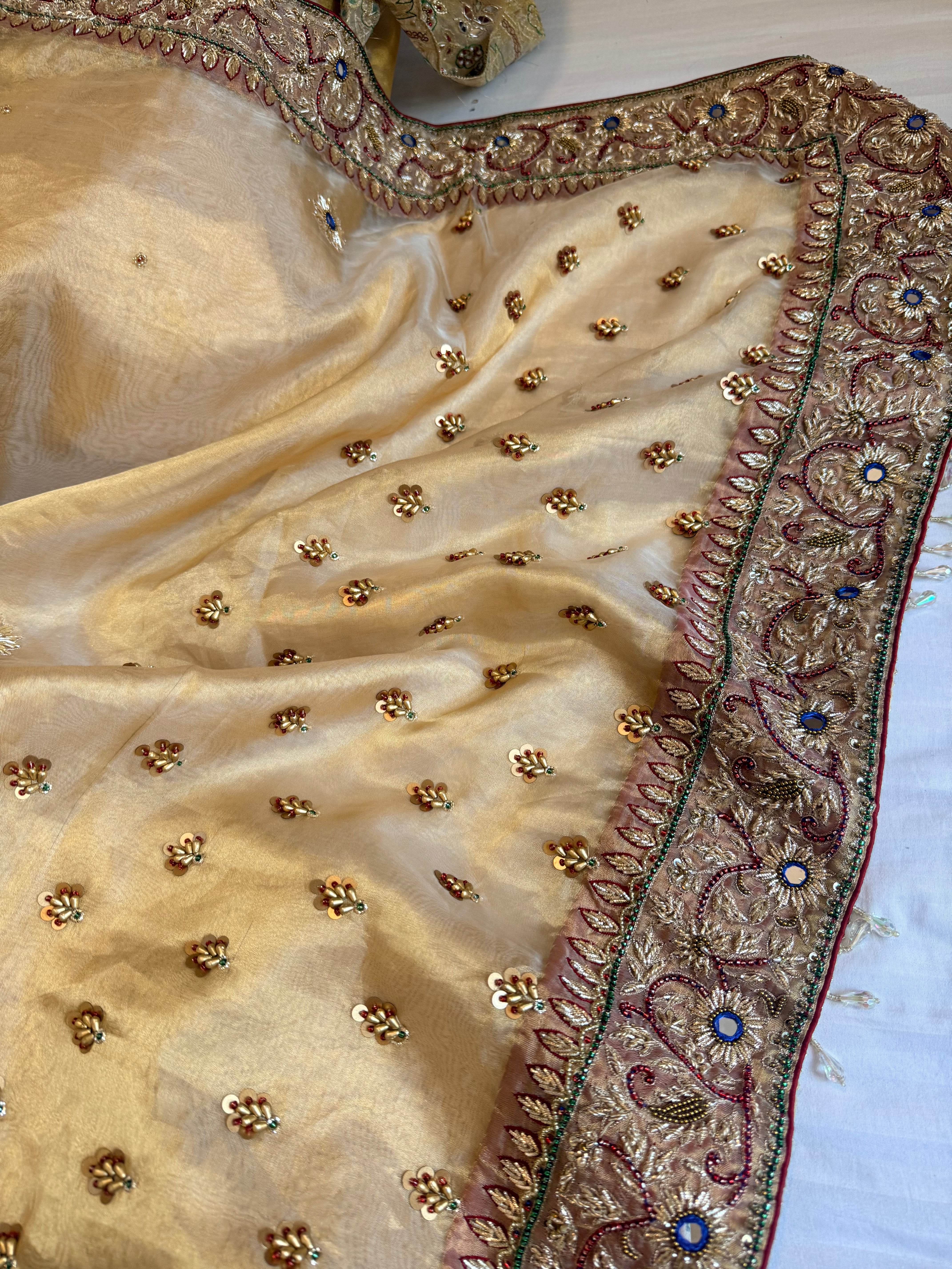 Zardozi & Jadauwork border tissue silk hand embroidered kadhwa butter gold saree